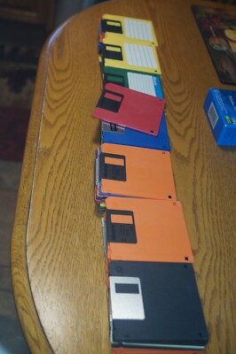 71 Floppy Disks.  With 2 storage boxes