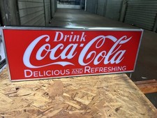 insegna luminosa Coca Cola