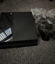 Sony PlayStation 4 with controller and charging dock