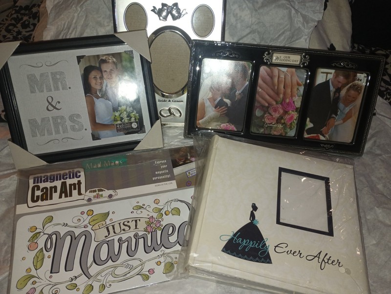wedding gifts, picture album, frames and magnetic car decal. All never used.