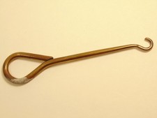 Older brass colored shoe button hook tarnish on handle end 
