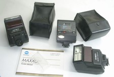 THREE powerful Minolta Maxxum 2800AF flashes w/cases, manual WIDE-ANGLE panel