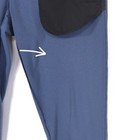 Blue 32 slim-fit THEORY men’s dress pants with black padding on hips, pointing towards white seam area.