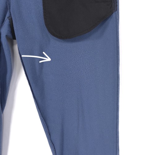 Blue 32 slim-fit THEORY men’s dress pants with black padding on hips, pointing towards white seam area.