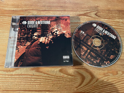 CD Pop Oxide & Neutrino   Execute (15 Song) WARNER EASTWEST jc