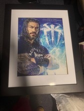 Framed autographed Roman Reigns poster