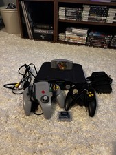 Nintendo N64 + Super Mario 64 and Two Controllers RED DESCRIPTION.