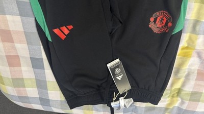 XS Puma Herren MUFC Manchester United Tiro Training Trainingshose schwarz 