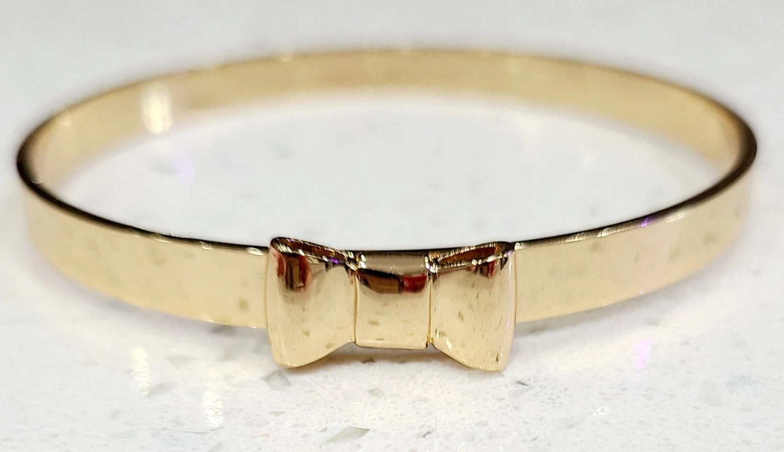 Bracciale Kate Spade New York Take A Bow tono oro 2 5"