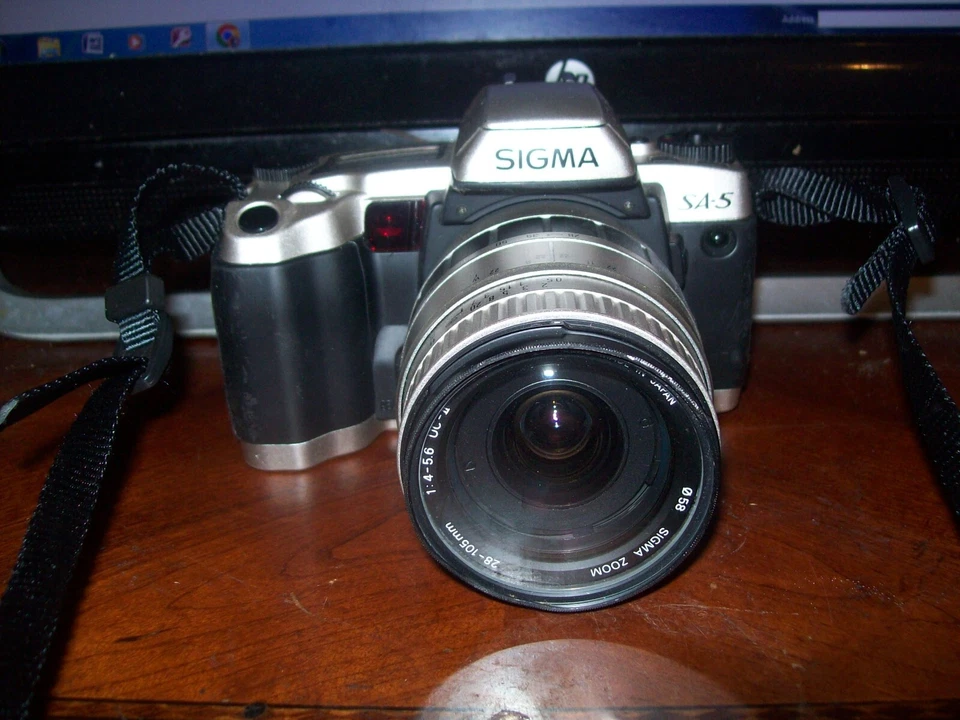 Cámara fotográfica SIGMA SA-5 con estuche, 5 filtros y 2 Len: 28-105 mm y 100-300 mm FUNCIONA Foto 2 de 3