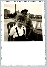 Vtg B&W Snapshot Boy in Suspenders And Older Man in Cap On Pier 1950s