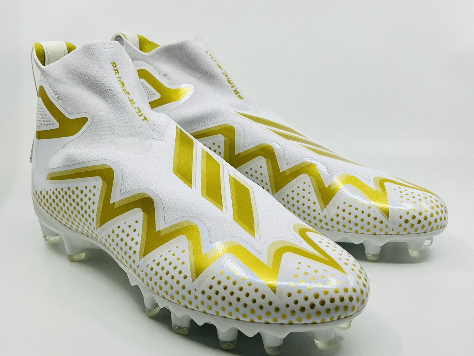 white and gold adidas cleats