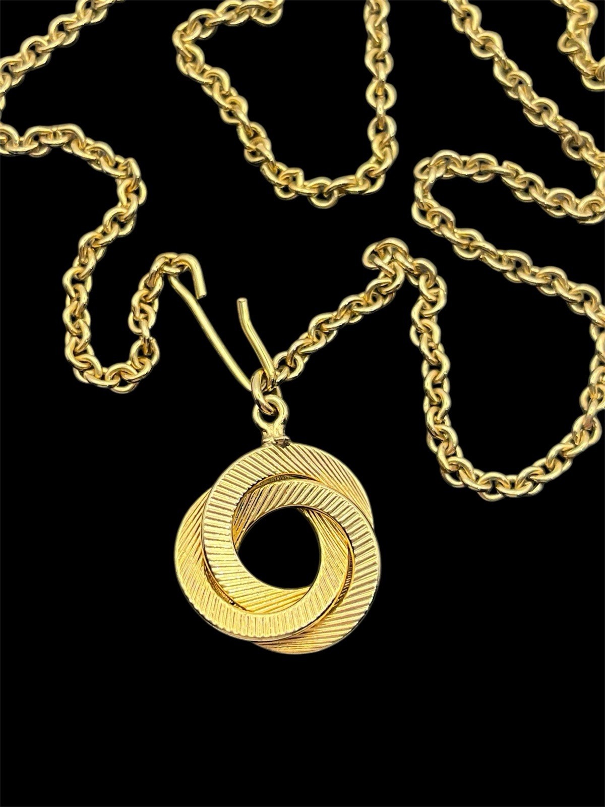 Engine turned gold tone triple interlocking circl… - image 2