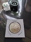 2026 P Half Dollar UNC  Slightly off center. Coins in hand.