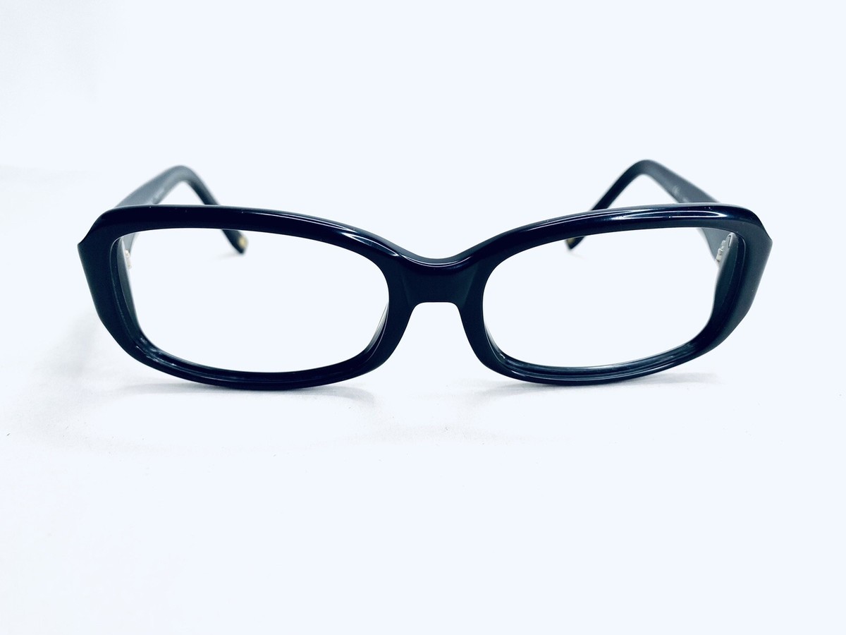 Anne Klein Sunglasses Frames. AKNY 3121. Black Full Rim Plastic. Lions On Side Anne Klein Black Chic Rounded Cat-Eye Sunglasses main image 3