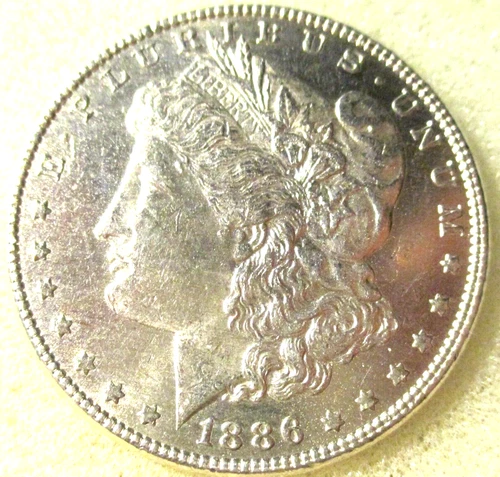 1886 MORGAN SILVER DOLLAR MS #141