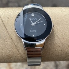 Studio Black Dial Round Silver Tone Case Open Cuff Hinge Bracelet Band Watch