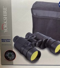 Binoculars with carry case, removable eye cups, built-in compass.