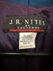 White fabric label on dark purple garment with red “J.R. Nites by Caliendo” text, product number RN23937, size 12.