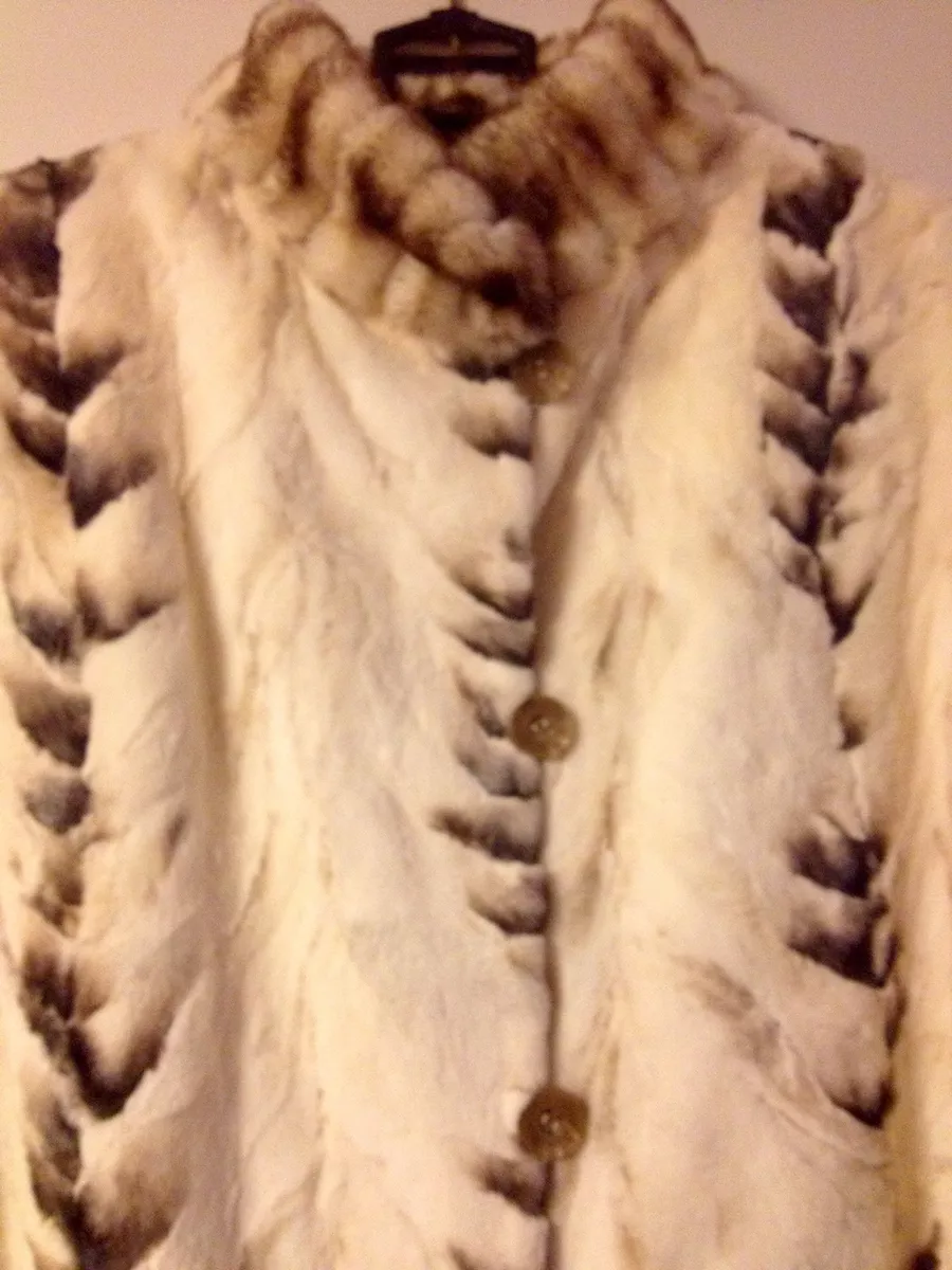 Sheared mink coat reversible to cheap raincoat