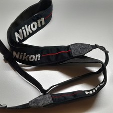 VINTAGE NIKON WIDE BLACK STRAP WITH WHITE LOGO  RED LINE MEASURES APPROX 97CM