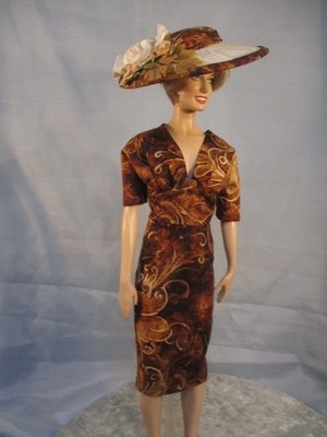 Bea a doll dress and hat for  Princess Diana. Doll not included.
