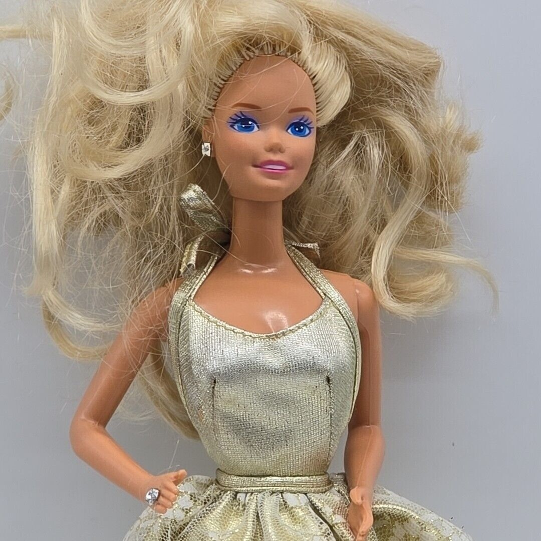 barbie blue and gold dress Barbie loves herself some Kenneth Sean Carson, Jr (Ken). Ken's birthday is March 11, 1961. Barbie wanted to wear a stunning gown to help man celebrate his 50th Birthday. Barbie understood the