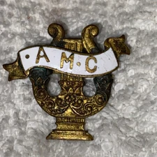 Antique A.M.C Gold Tone Music Note Pinback