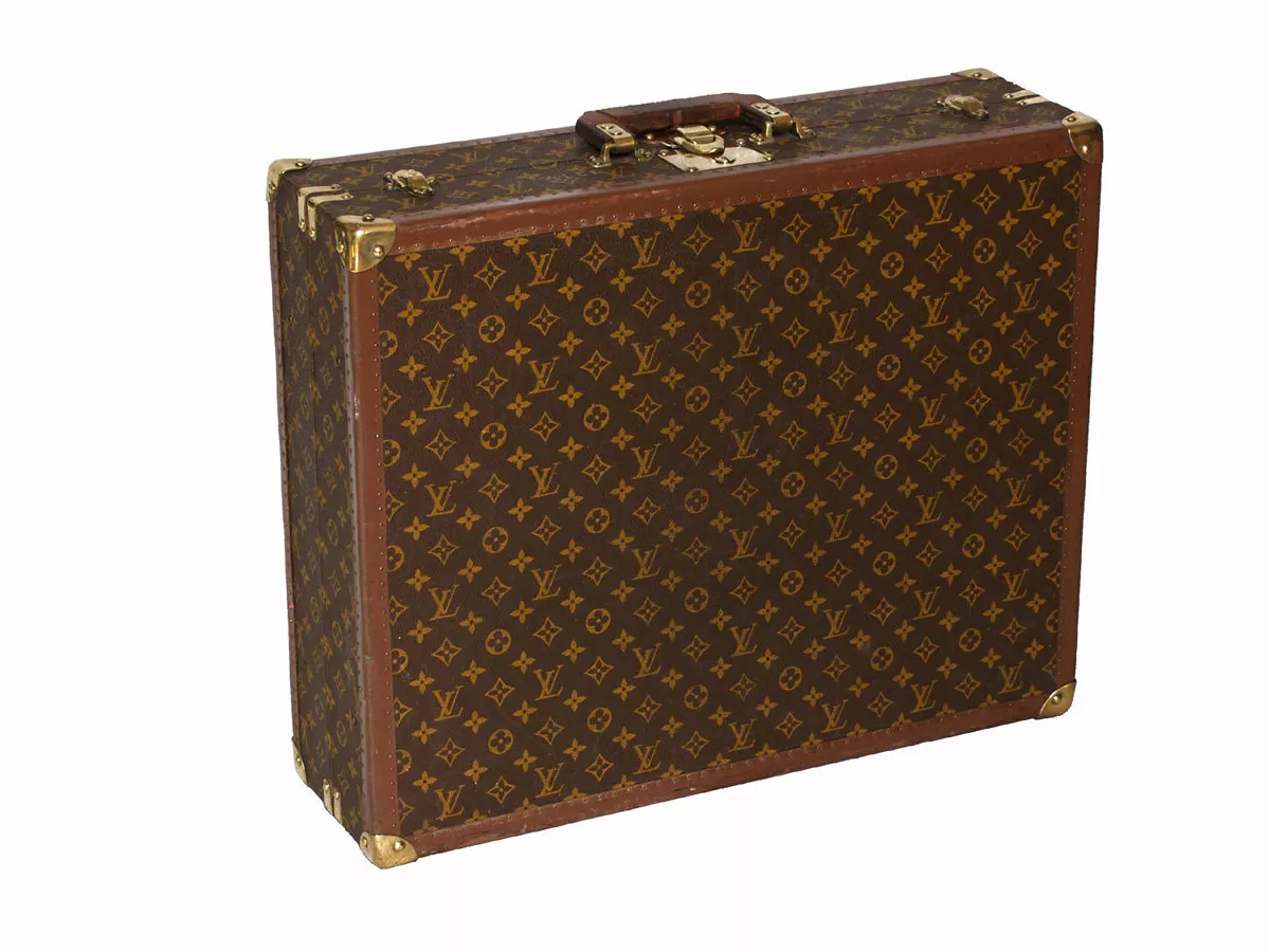 Louis Vuitton monogram suitcase trunk open by center, square handle.