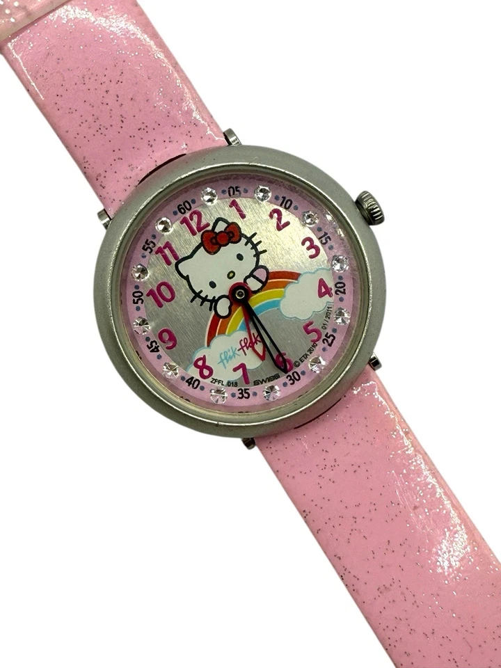 Reloj antiaéreo Sanrio Hello Kitty On Rainbow Flik correa rosa suiza batería nueva Foto 2 de 4