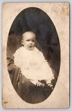 Postcard RPPC Baby in White Dress Sitting in Chair Real Photo Oval Vignette