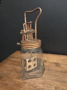This is a Dazey-style glass butter churn.