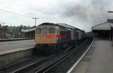 PHOTO  CLASS 33 33033 WITH CLASSMATE PASSING BASINGSTOKE IN 1979