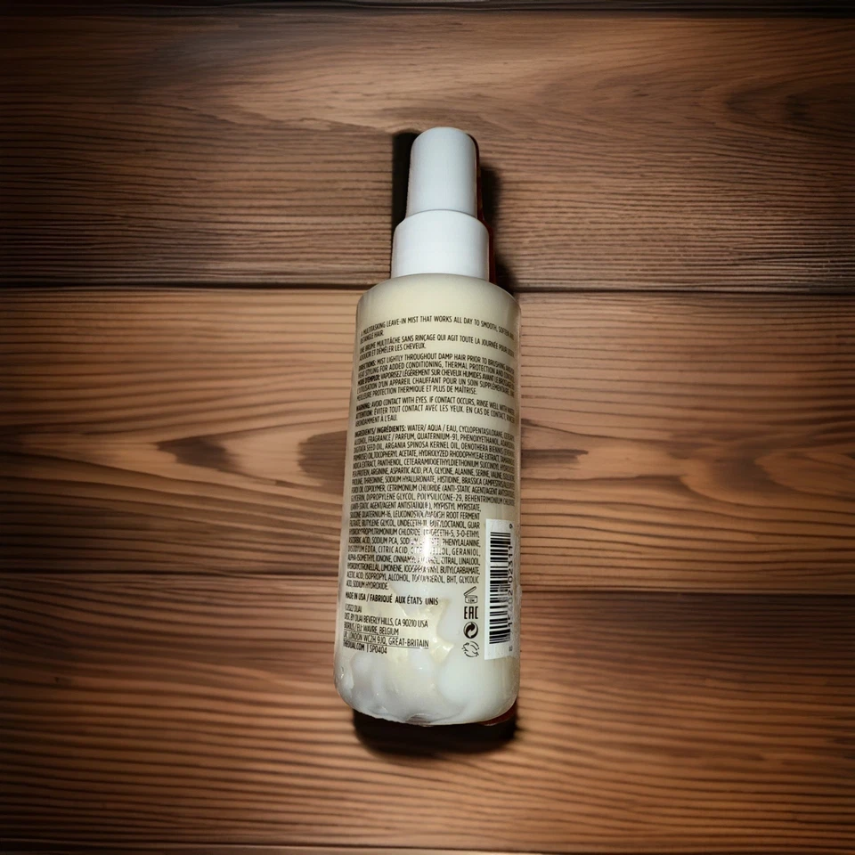 Acondicionador sin enjuague OUAI, niebla multitarea, protege contra el calor y el friz Foto 2 de 2