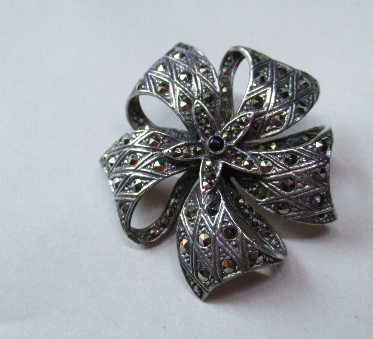 Vintage Silver Bow Brooch with Black Center Stone and Marcasite What are the letters on the back of a marcasite bow brooch? main image 3