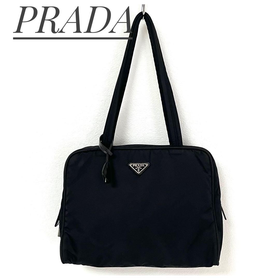Prada black tote bag with triangle logo and cadena key chain