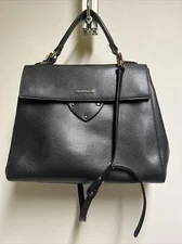 coccinelle black leather handbag with sholder strap and top handle and gold hard