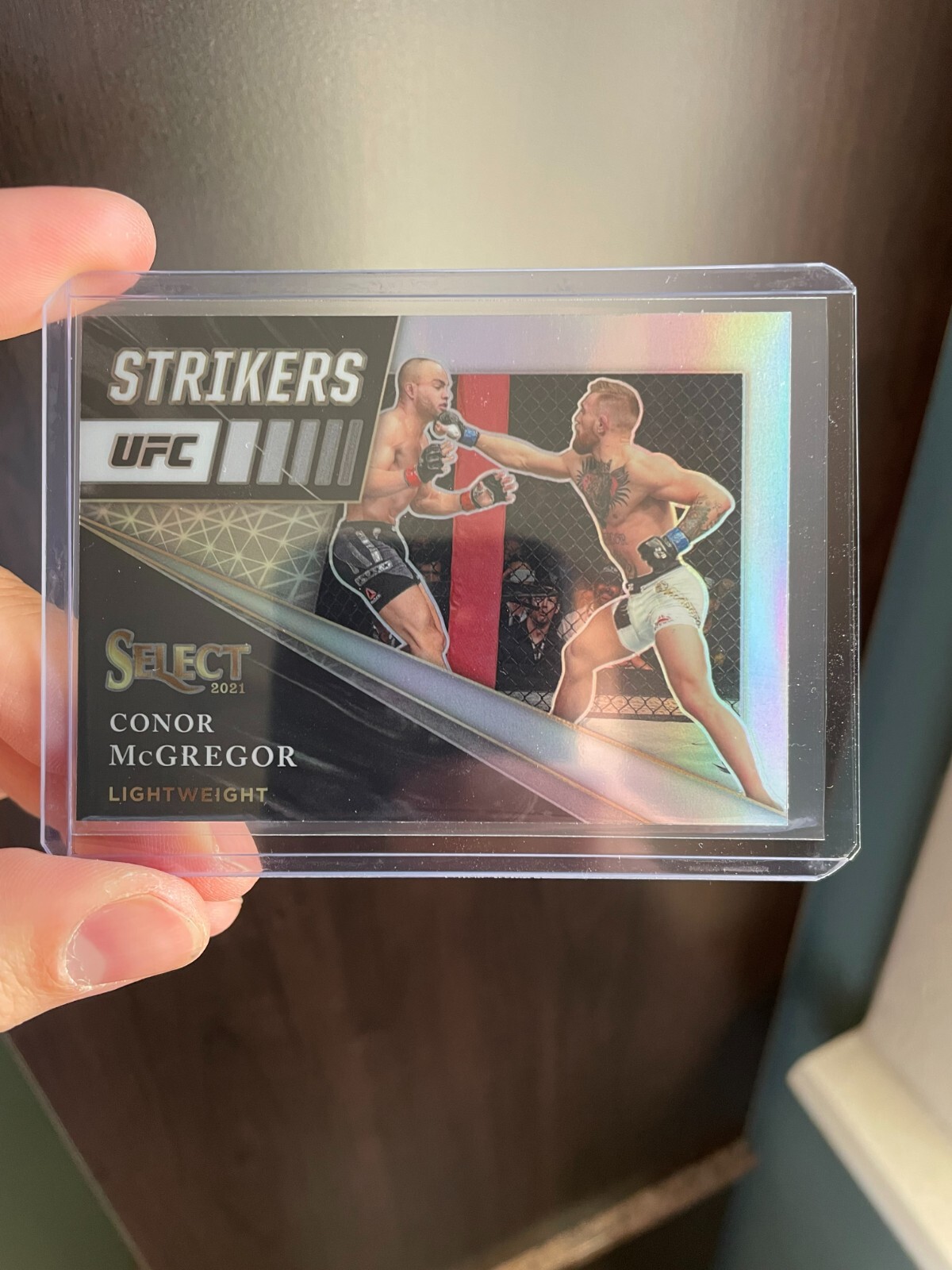 Conor McGregor Select Strikers Insert #8 Silver Prizm - 2021 Panini Select UFC