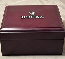 vintage burgundy Rolex watch presentation box with a raised silver crown logo