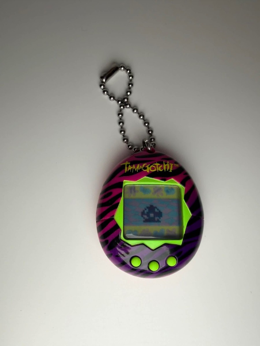 Tamagotchi Bandai Gen 1 Pink Virtual Reality Pet with Zebra