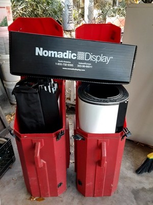 Nomadic Display Trade Show Booth with Red Cases, Panels & Accessories