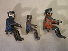 3 cast iron car drivers.