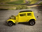 HOT WHEELS YELLOW  CLASSIC FORD VICKY FAO SCHWARZ HISTORY OF HW, RED LINE TIRES