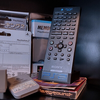 PlayStation 2 DVD Remote Control Stand Holder Storage Display SCPH