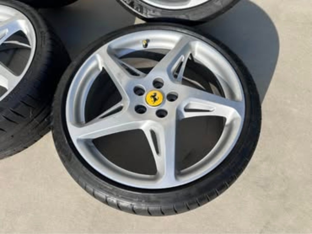 Here is a full set of ferrari original Wheels off of a 458 italia. 