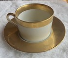 Fitz and Floyd porcelain cup and saucer with gold accents carre d'Or