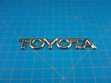 Toyota OEM Chrome Emblem Badge 75417-AA010 Genuine Rear Trunk Nameplate Trim