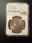 1935 Peace Dollar NGC UNC Details  - Obverse Scratched -Toned
