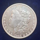 1890-O Morgan Silver Dollar Slightly toned edges on its reverse