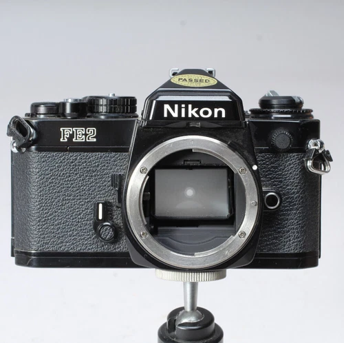 BLACK NIKON FE2 35MM SLR BODY METER WORKS SHUTTER FIRES BUT NEEDS WORK